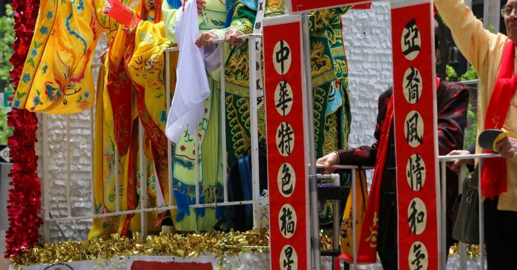 Vibrant parade float celebrating Asian Pacific American heritage in New York City.