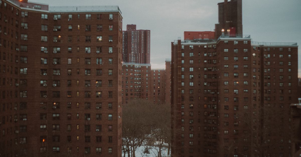 Urban New York City apartment buildings at dusk, showcasing winter ambiance.