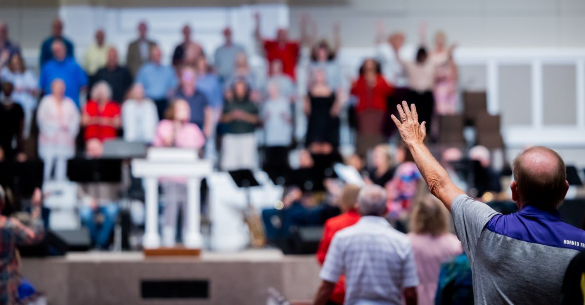 A church congregation participates in a worship service with a focus on community and spirituality.
