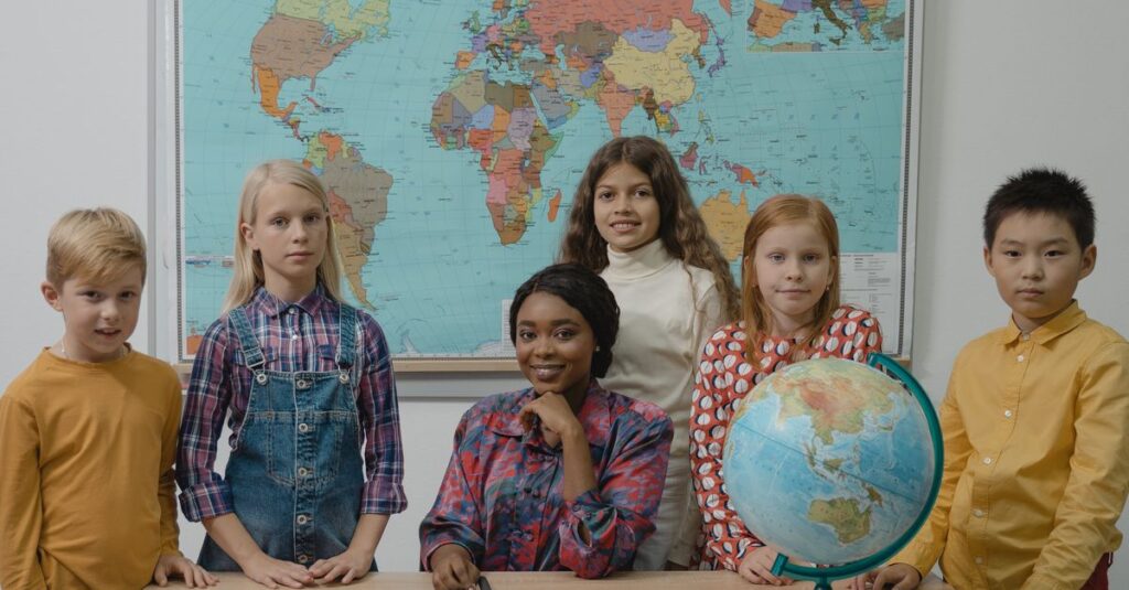 Children learning geography in an elementary classroom with a globe and world map.