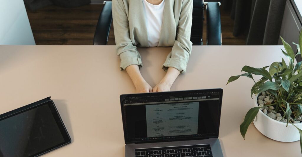 High-angle view of a job interview in a modern office setting, capturing professionalism.