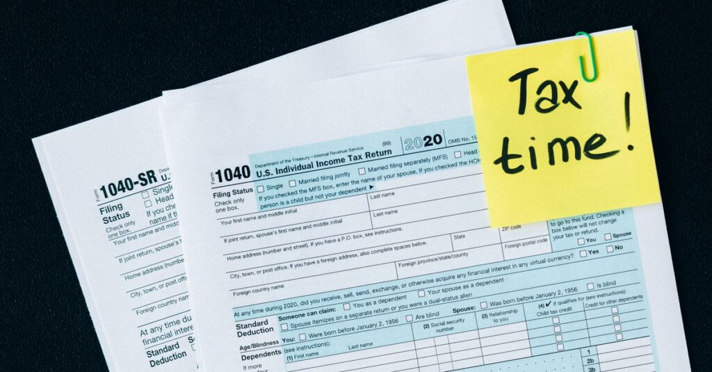 U.S. tax documents with a 'Tax time!' reminder, highlighting the importance of filing deadlines.