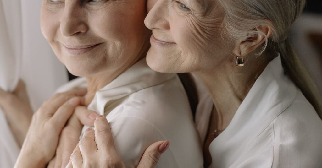 Elderly women sharing a tender moment, reflecting love and togetherness.