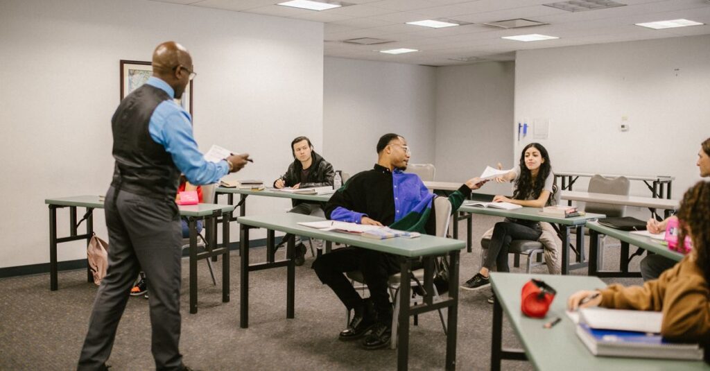 University classroom with students receiving instructions from a professor.
