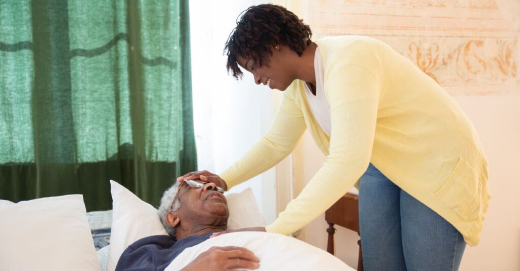 A loving daughter tends to her elderly father at home, offering comfort and care.