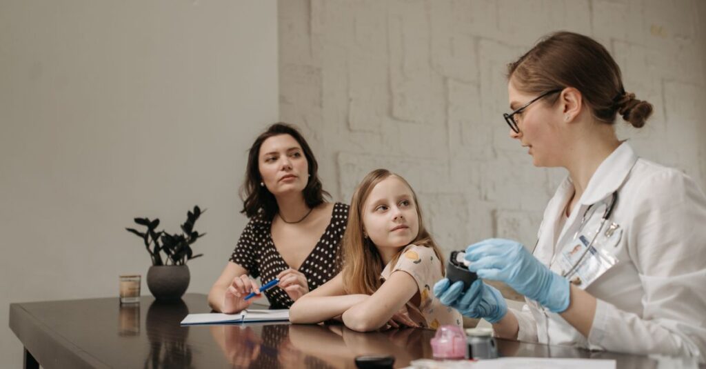 A doctor in a white coat consults a young girl and her mother about health in an indoor setting.