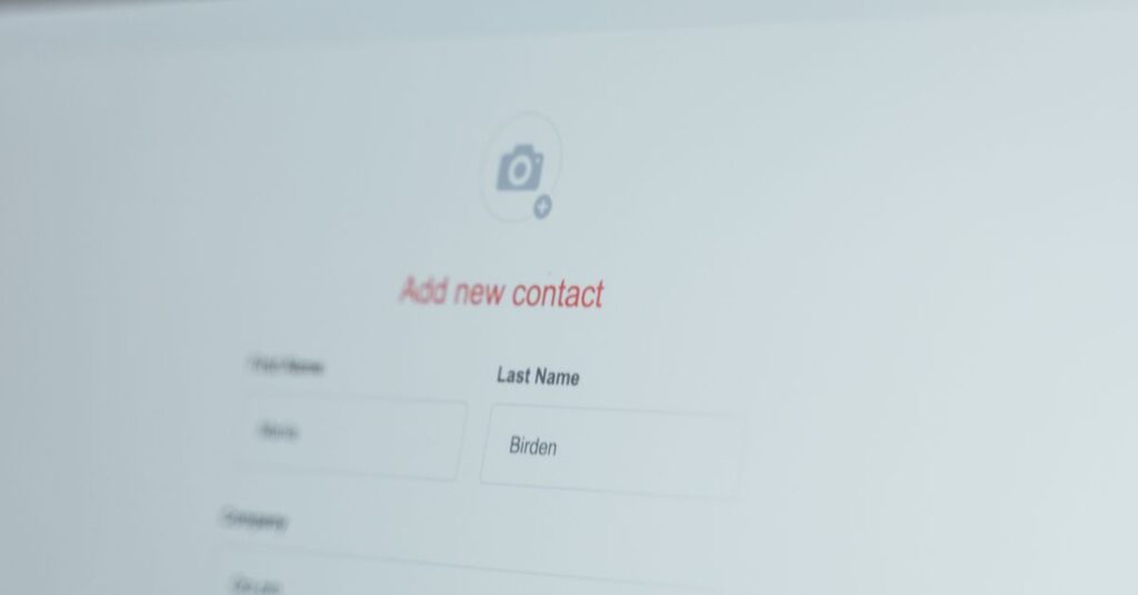 Close-up of a computer screen with an open contact form for adding a new entry.