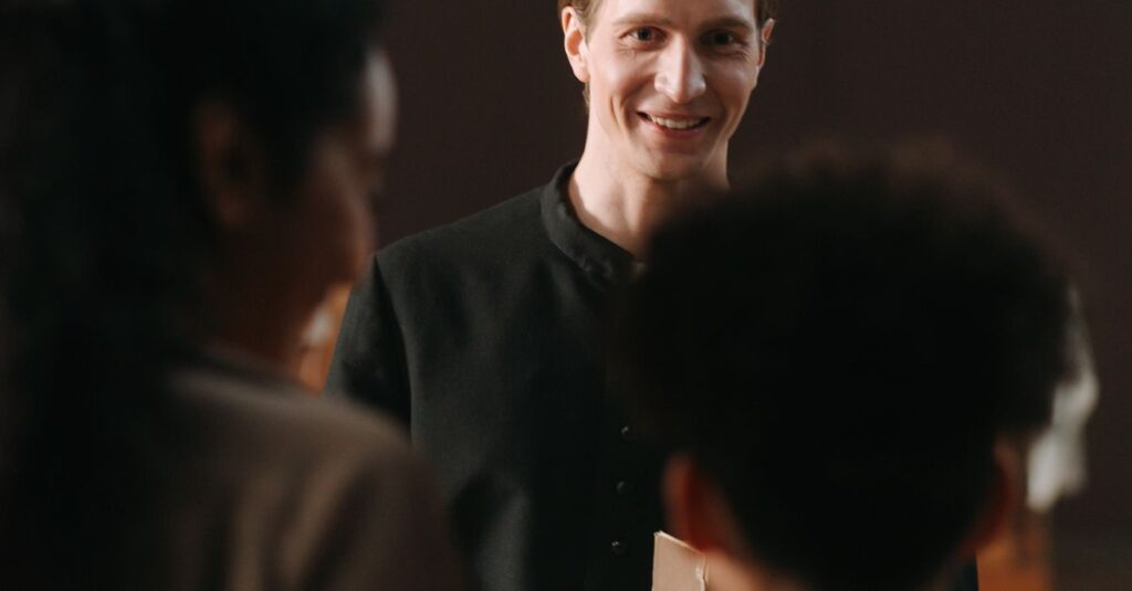A smiling priest engages with parishioners in a church environment, exuding warmth and connection.